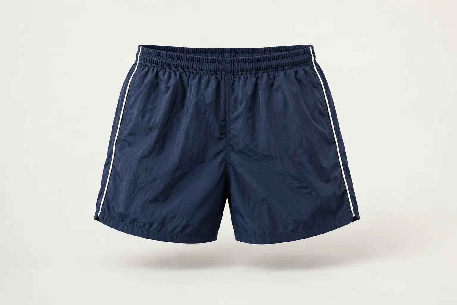 Navy nylon windbreaker shorts with white side piping